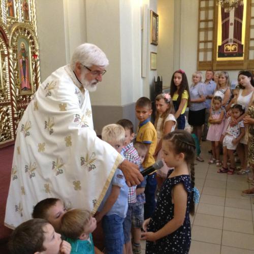 Fr. John speaks to children in Redemptorist church of St. Joseph's in Lviv